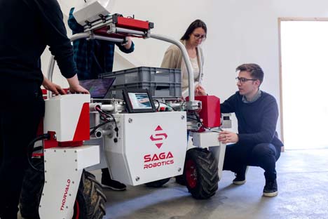 Robotics engineers at work on a robot.